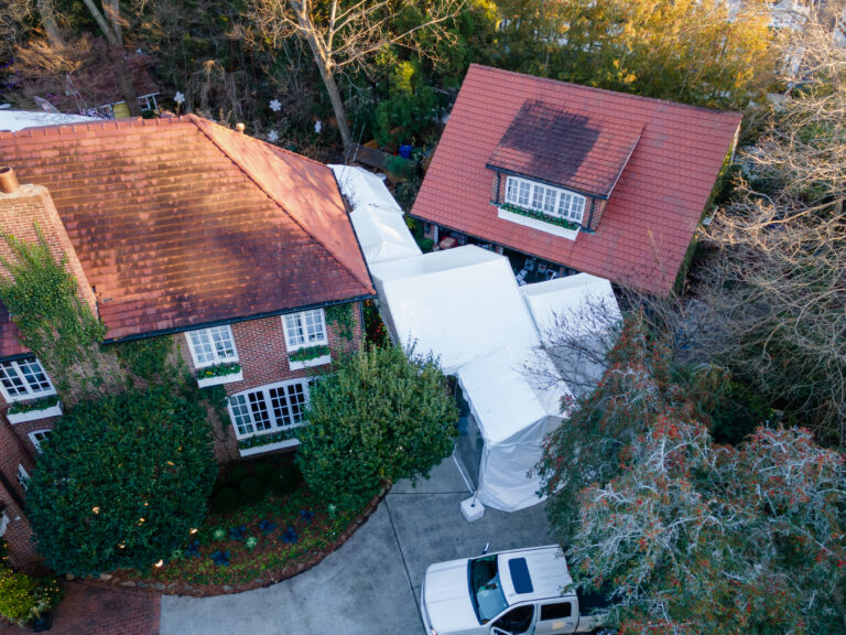 Custom tent installations showing connected marquee tents in a residential backyard