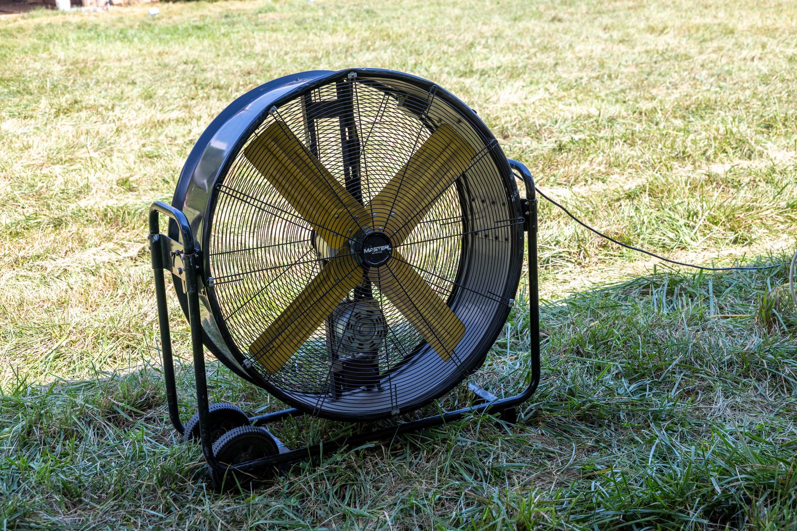 36" drum fan on the lawn at the private-home wedding.
