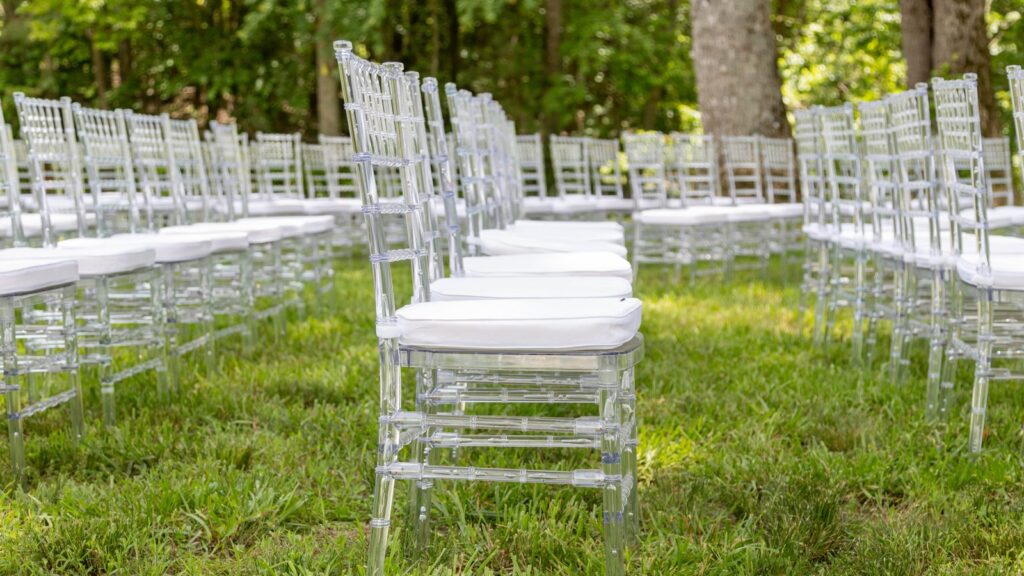 A row of Clear Chiavari Chairs set for a wedding ceremony