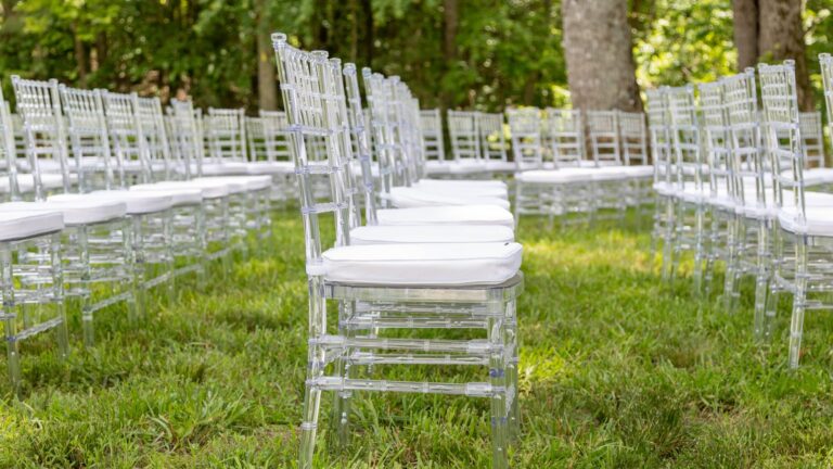 A row of Clear Chiavari Chairs set for a wedding ceremony